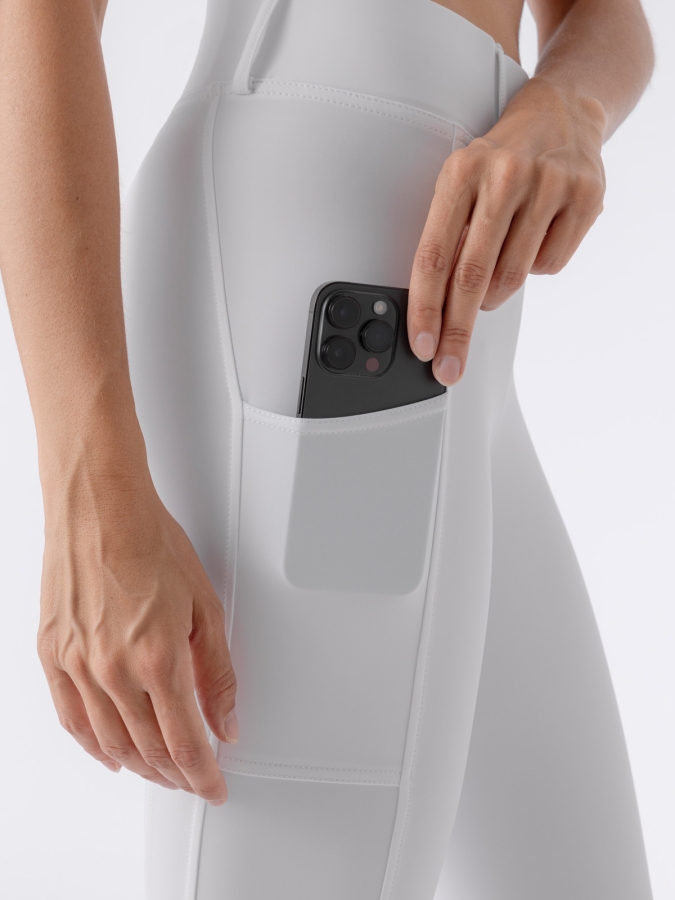 CARBEK &ndash; Leggings bianchi da donna con grip ginocchio e tasca per cellulare